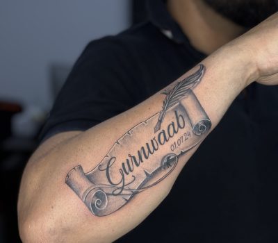 Calligraphy Tattoo : "Letters of Light: A Testament Etched Across Time and Skin"